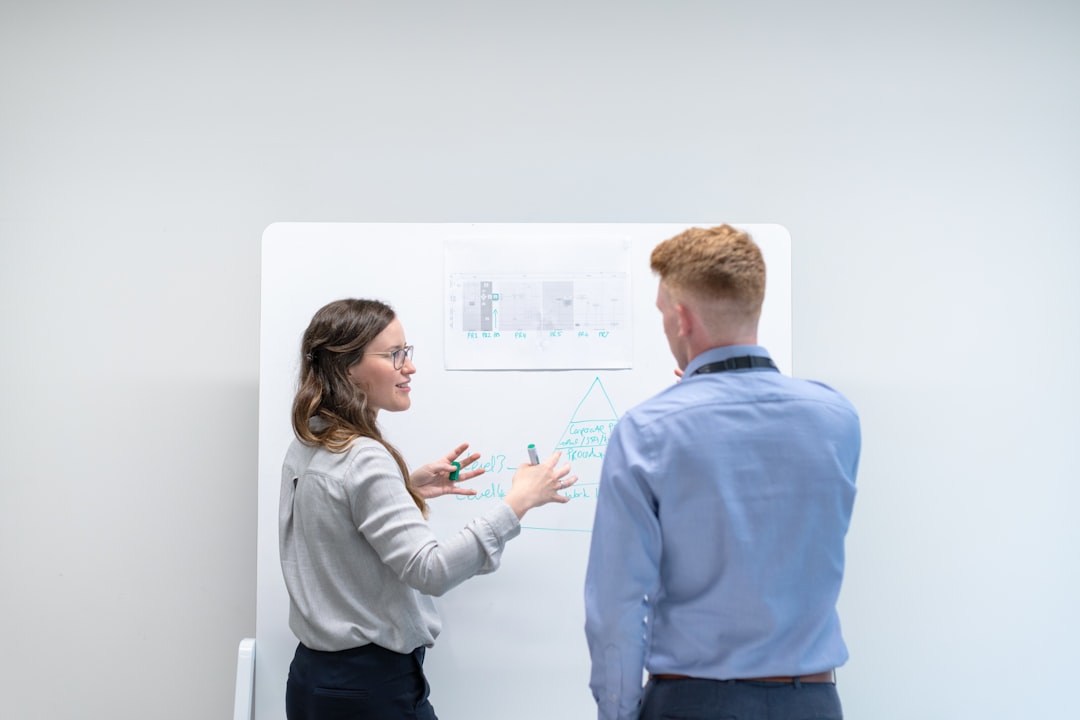 Professional team conducting digital strategy workshop with strategic documents and growth charts